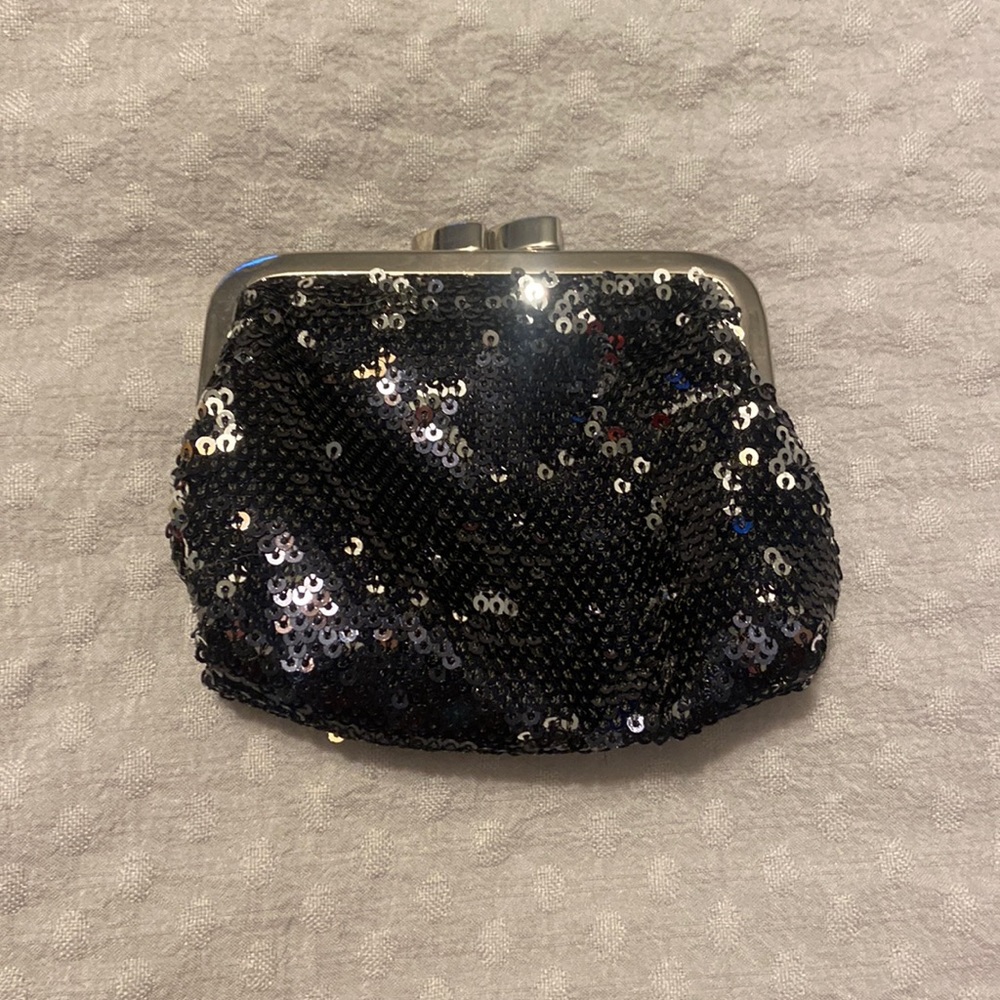 Tiny (fits in palm), black, silver, sequin, coin purse from Victoria's Secret.